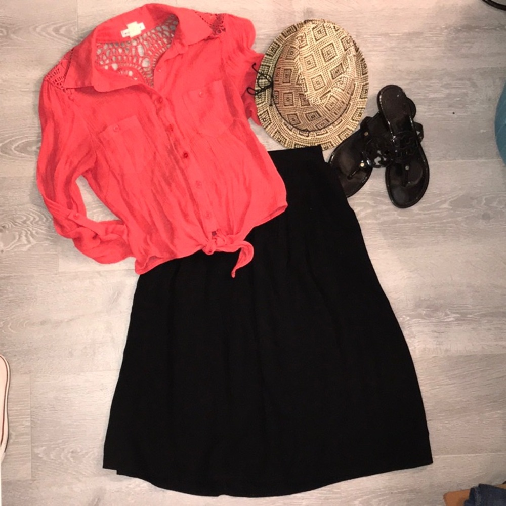 Ladies black calf length skirt with pockets